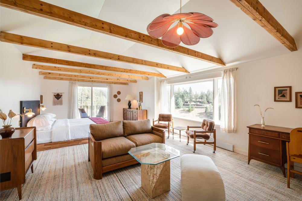 A cream and wood themed room with simple white decor and farmhouse accents.