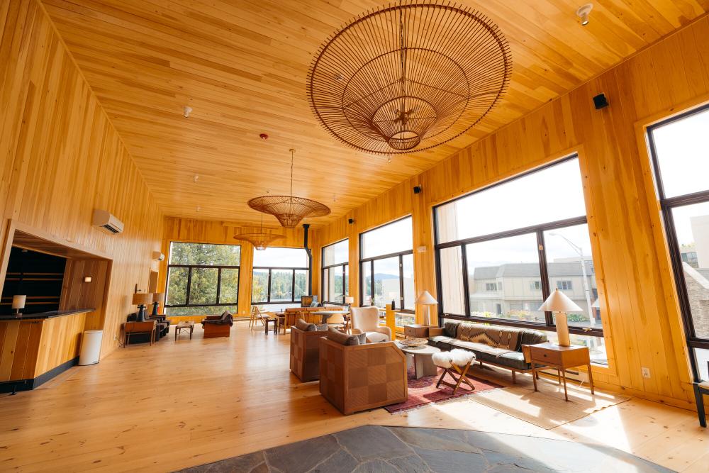 open common area with heavy wood themes and high cielings.