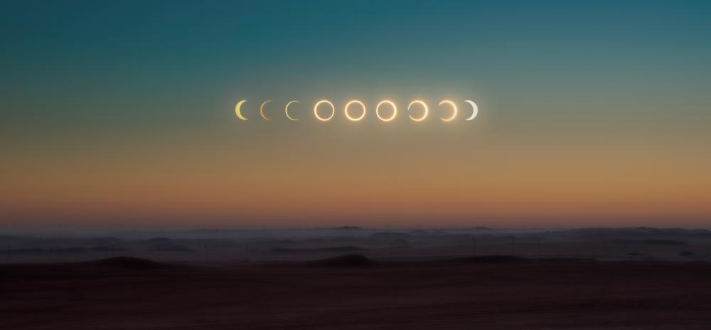 A composite image of the progression of a total solar eclipse.