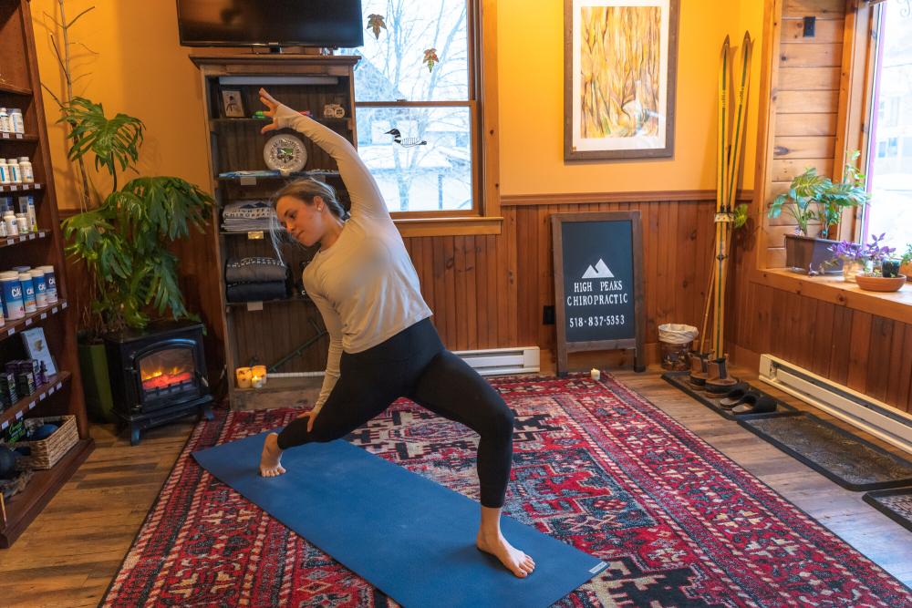 A woman does a yoga pose