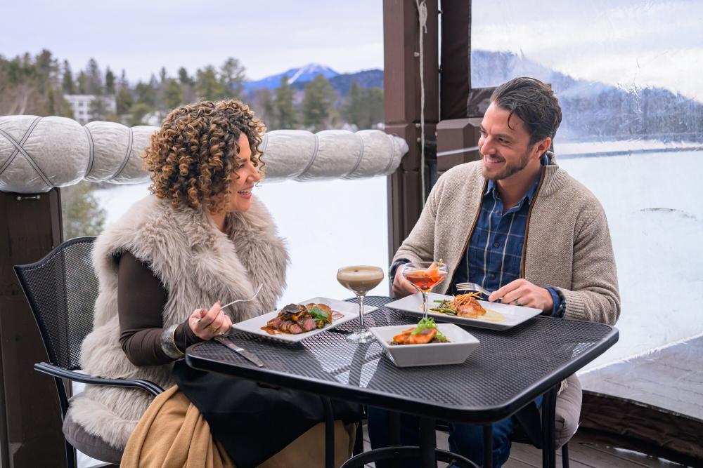 Outdoor Dining at Top of the Park Man and woman dine on outdoor deck in winter