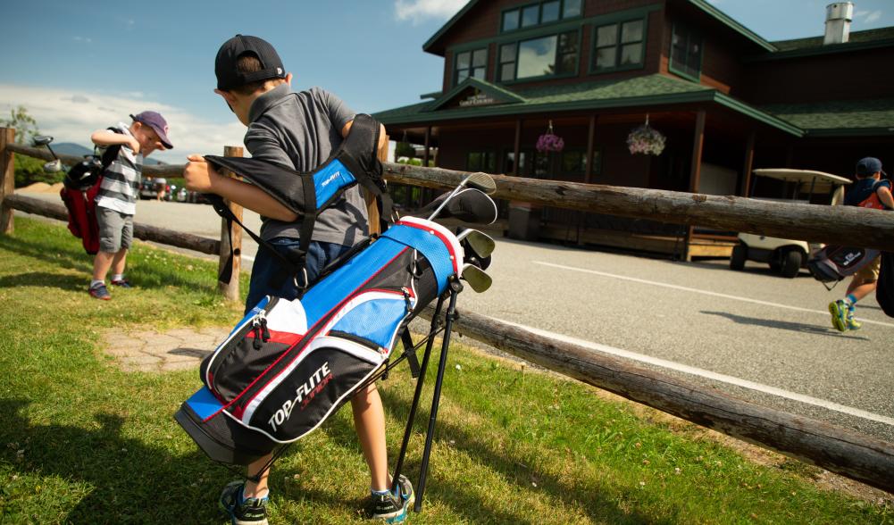 kids put on golf bags to go golfing.