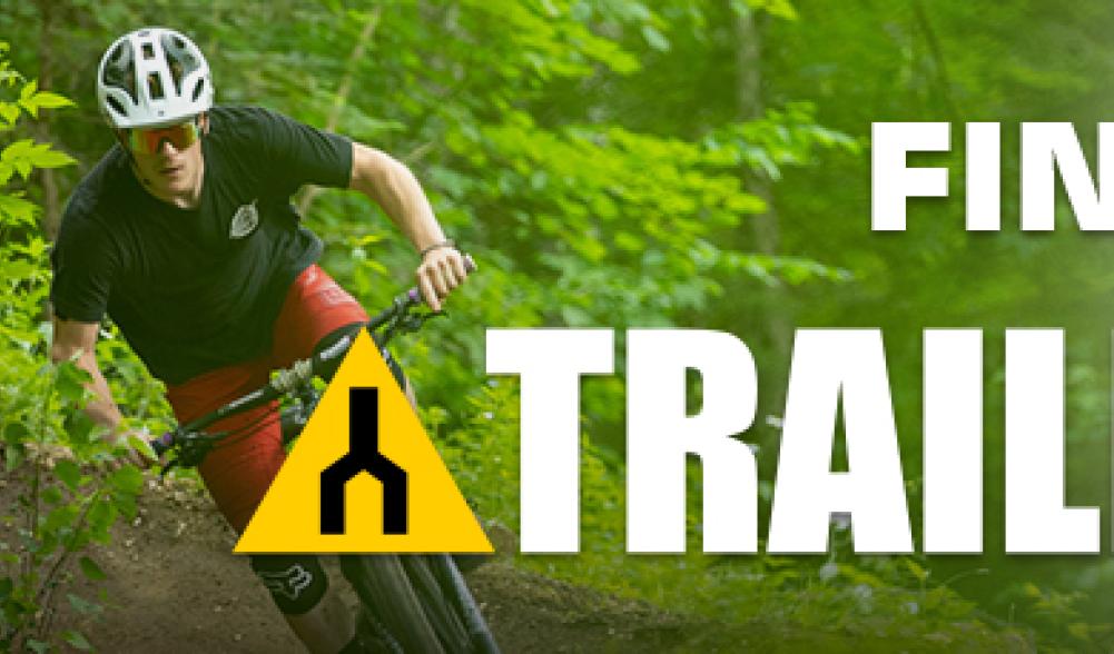 A banner for Trailforks.com featuring a mountain biker