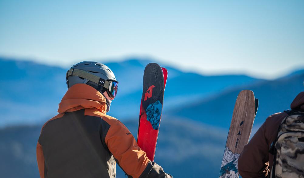 A skier looks out to the view.