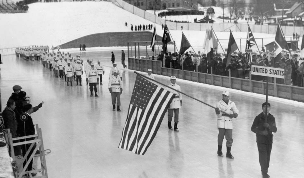 Black and white image of the opening ceremony of the 1932 Olympic Winter Games.