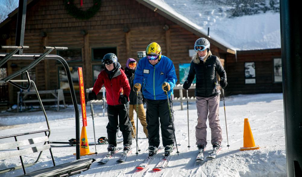 Two skiers start a lesson.