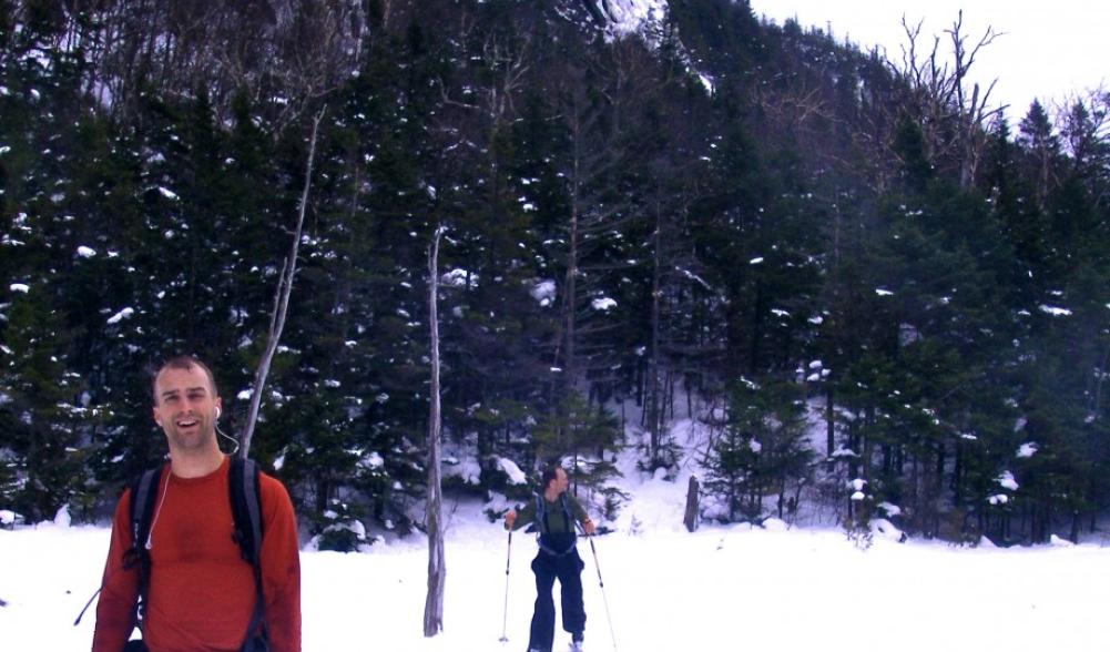 A satisfied skier reaches Avalanche Lake