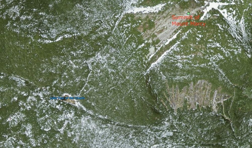 Lake Tear of the Clouds sits in a col to the southwest of the summit of Mt. Marcy, the highest point in New York State