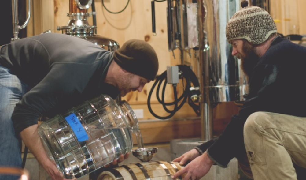 Pouring the Apple Brandy into the wooden barrels!