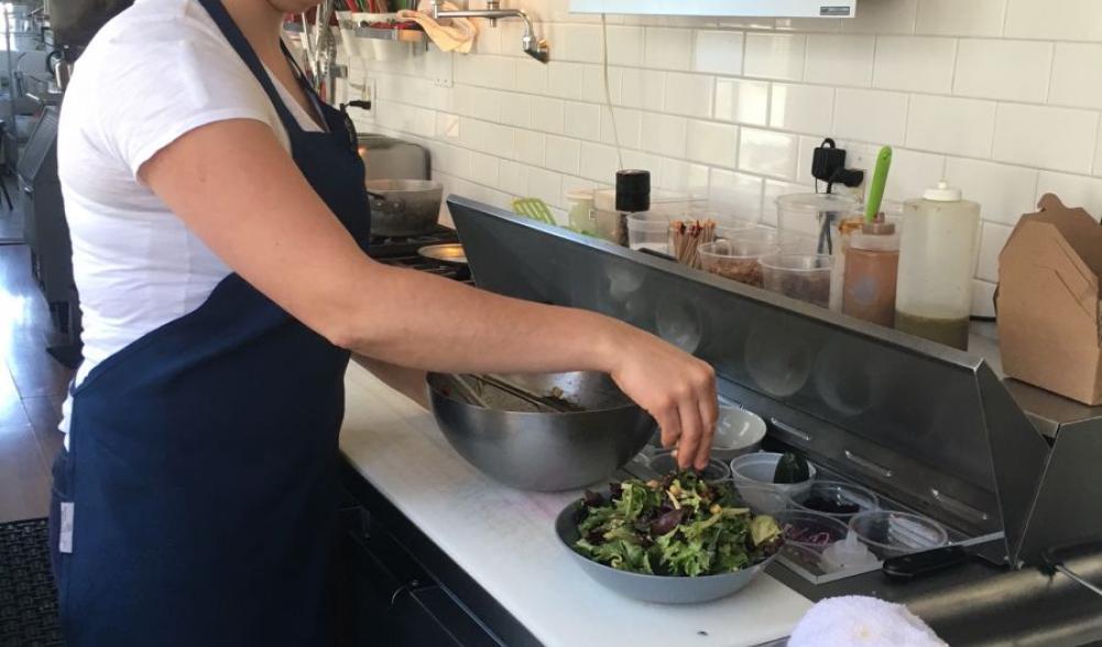 Kayte puts the finishing touches on a delicious, delicious house salad.