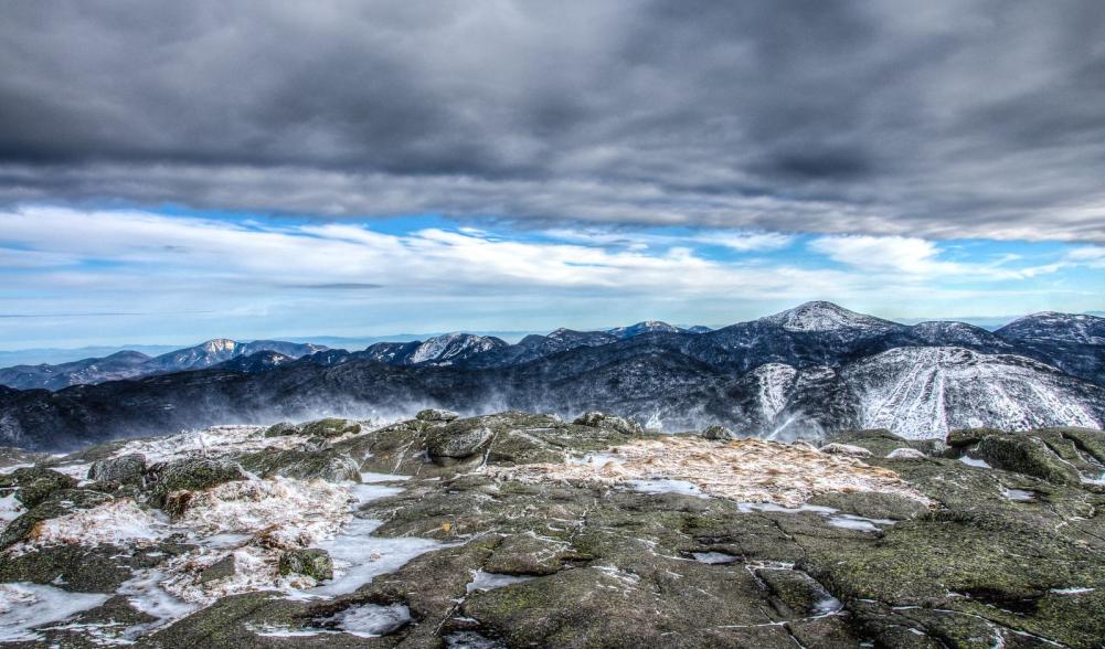 Beautiful and harsh, winter lingers on Algonquin's summit long after the snow has melted elsewhere. Photo by Brendan Wiltse.