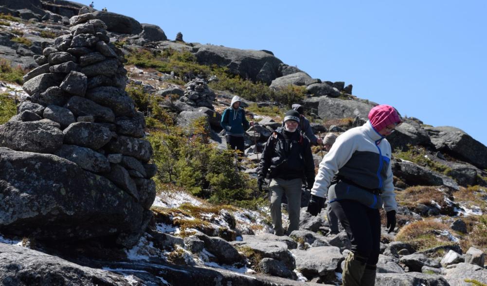 Hikers descend Algonquin's steep summit cone.