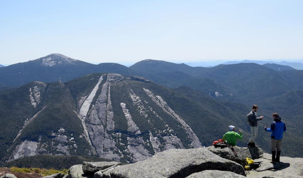 Hikers flock to the summit of Algonquin Peak.