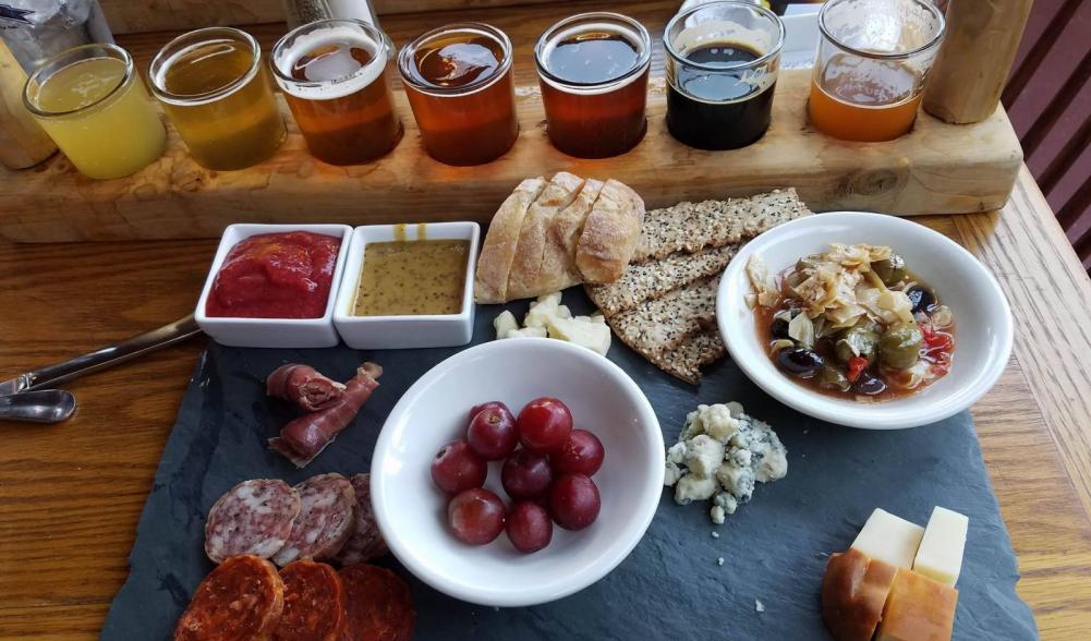 My beer flight accompanied by a delightful cheese and meat platter.