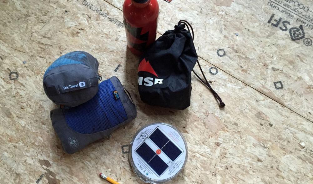 Stove, towels and lantern, with a pencil for scale.