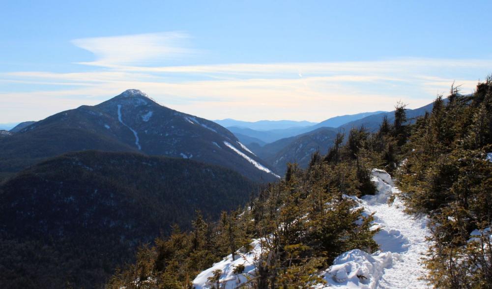 A panorama of mountains opens up just before the summit.