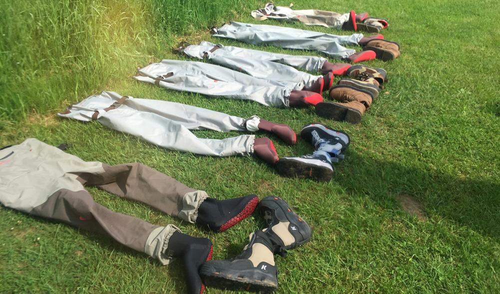 Empty waders and boots await riverwalkers.