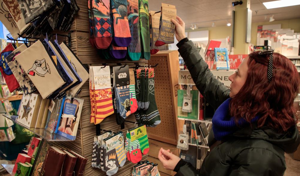 A woman shopping in Lake Placid for colorful socks
