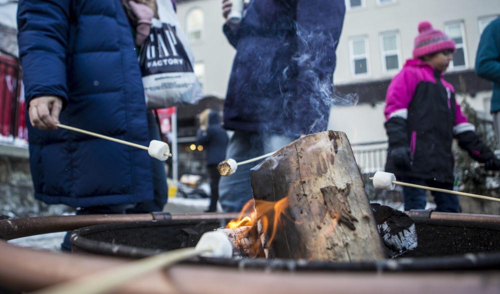 Close-up of roasting marshmallows on a firepit downtown.