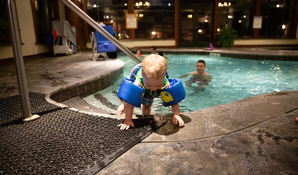 A family enjoys a small indoor pool in Lake Placid in the winter.