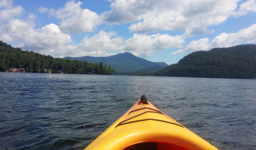 A kayak on Lake Placid lake. Whiteface Mountain is in the background.
