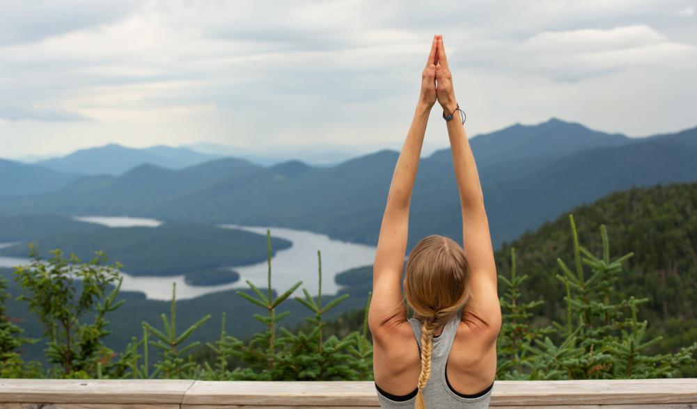 A woman doing yoga on Whiteface Mountain.