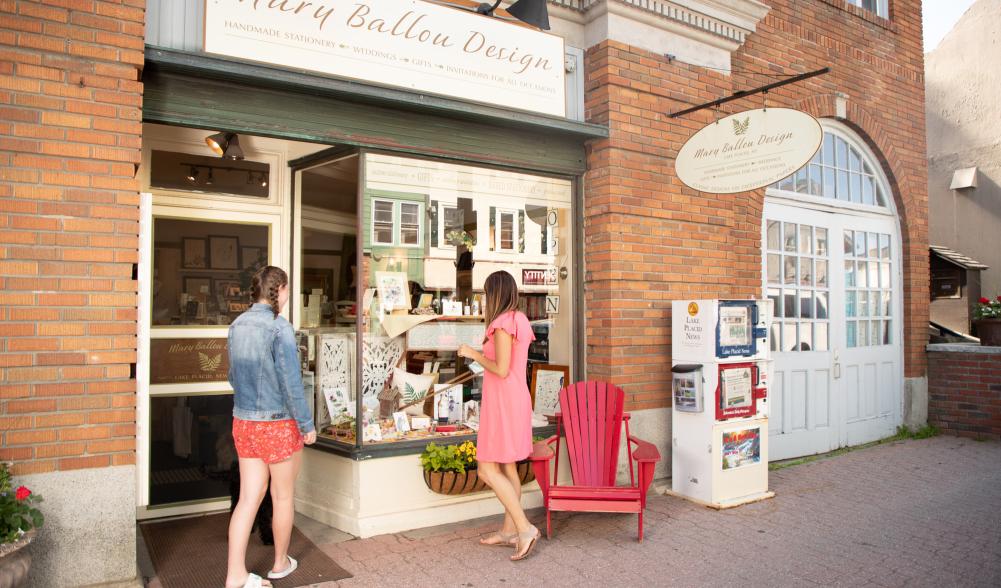 Two women browse Lake Placid's Main Street in the summer.