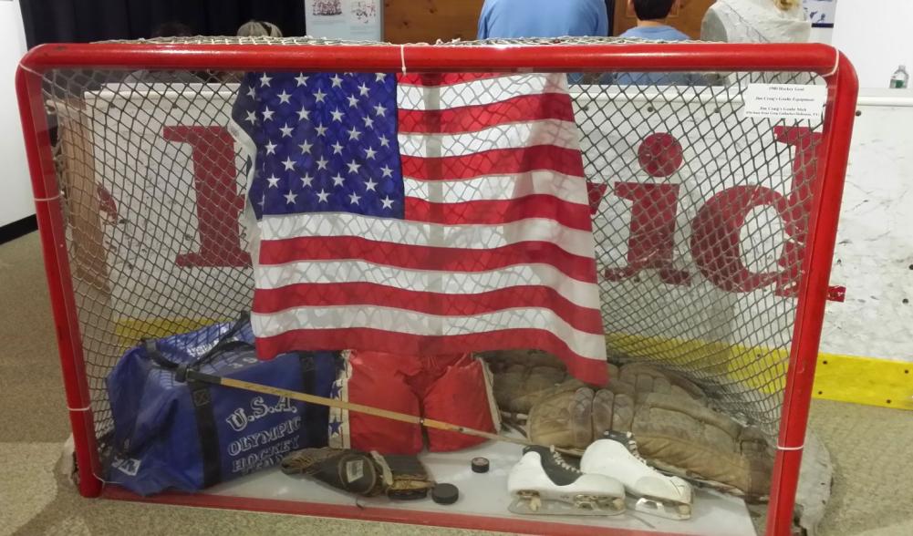 Picture of the hockey net and gear used during the 1980 Olympics on display at the Lake Placid Olympic Museum