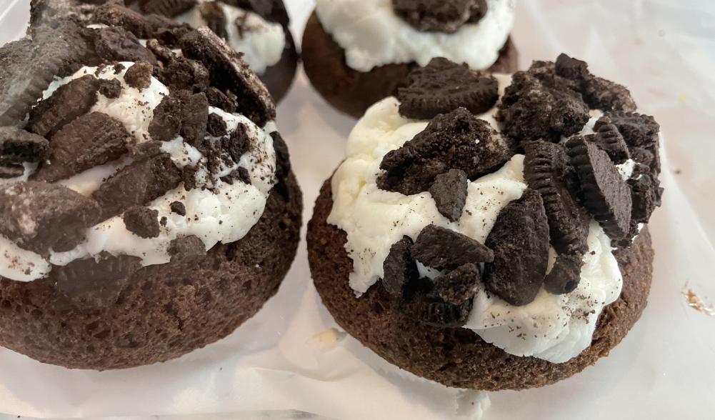 A close-up of cookies and cream donuts.