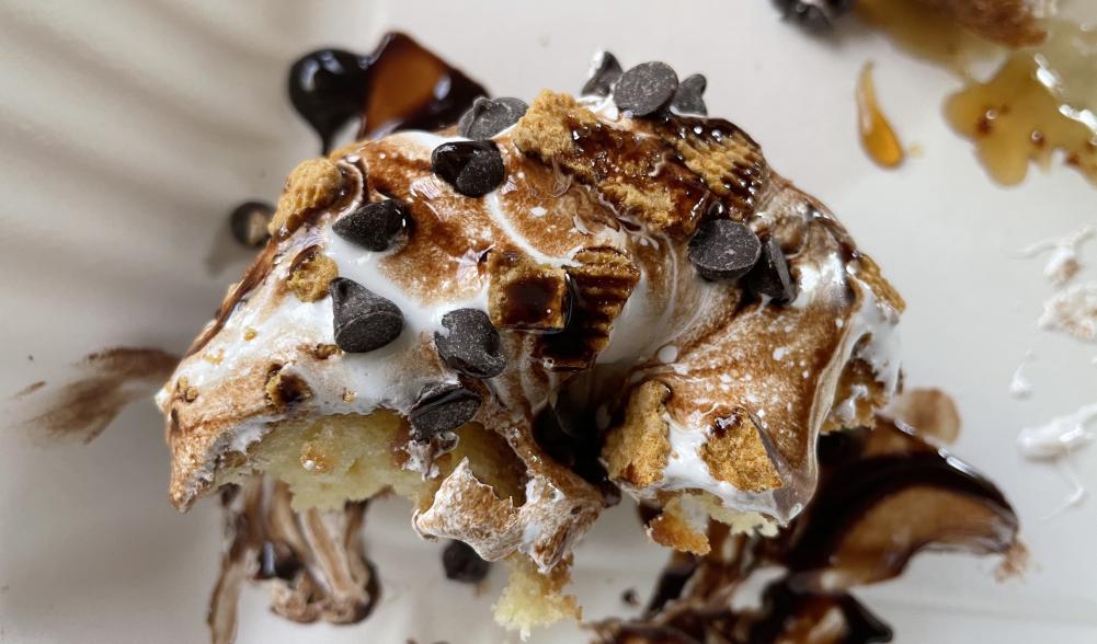 Close-up of what's left of a Campfire Donut, with chocolate chips and marshmallow on top.