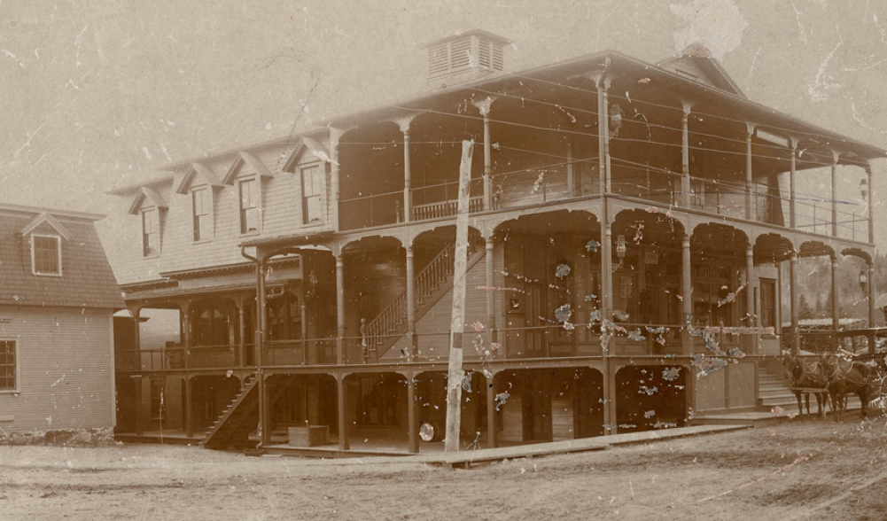 An early photograph of White's Opera House, a three-story Victorian building built in 1885.