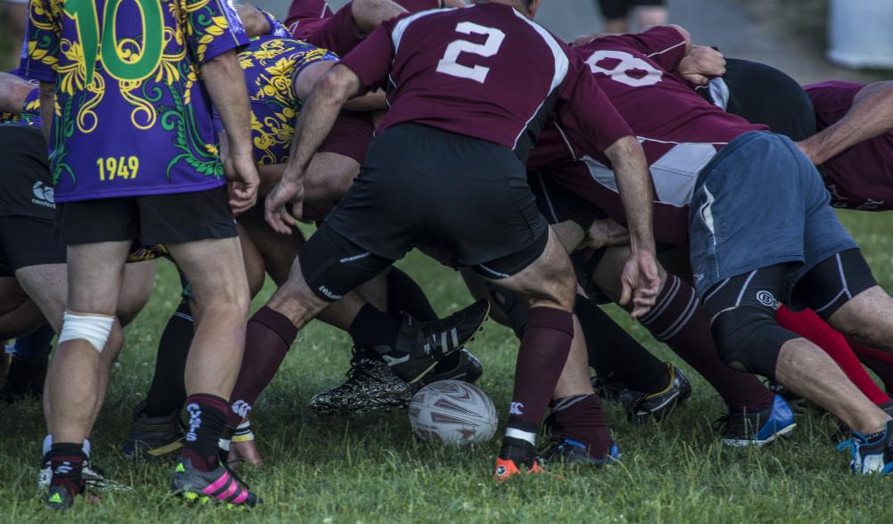 Rugy players pile up in a scrum