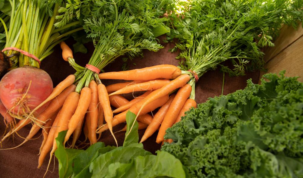 Carrots and other vegetables on a table.