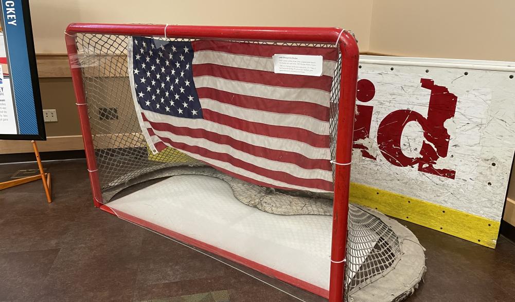 A hockey goal net and rink boards on display. They were used in the 1980 Olympic Winter Games.
