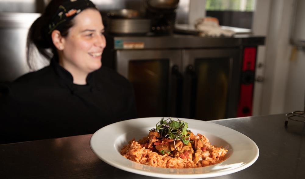 Chef with her dish on the counter