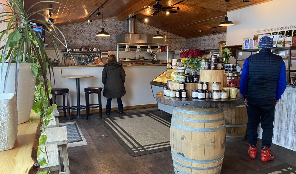 Two people wander around the shop as Dan and Rene bake behind the counter