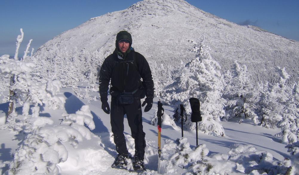 A hiker in the High Peaks in winter. Very snowy conditions.