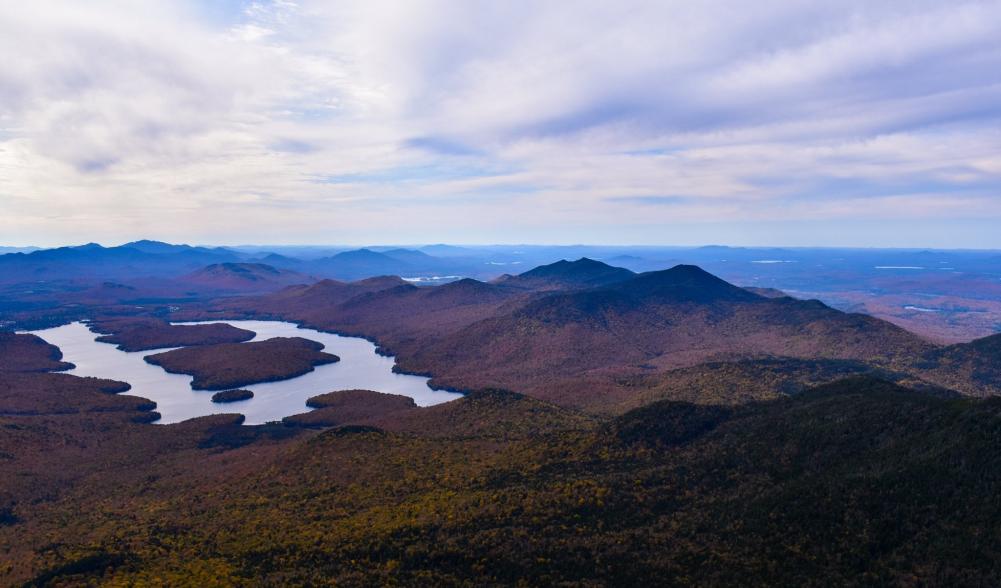 A mountain view with Lake Placid's iconic horseshoe shape below.