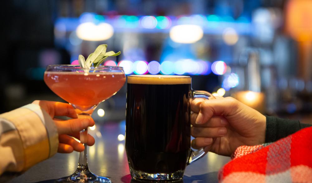 couple cheers with their beverages