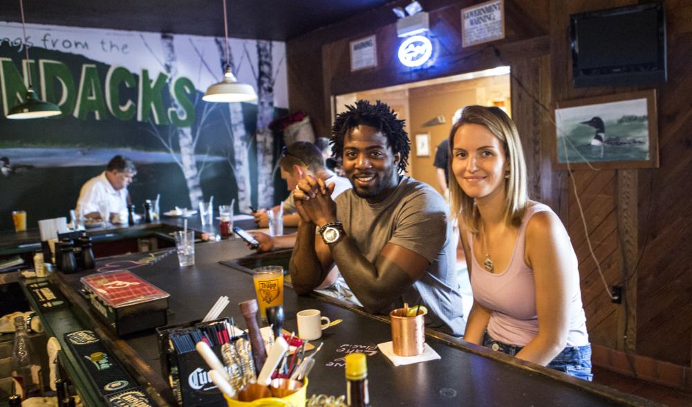 two people eating at the bar