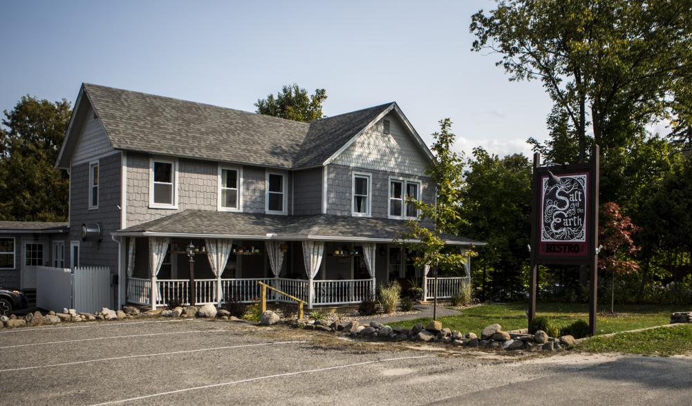 restaurant located inside of a charming gray house