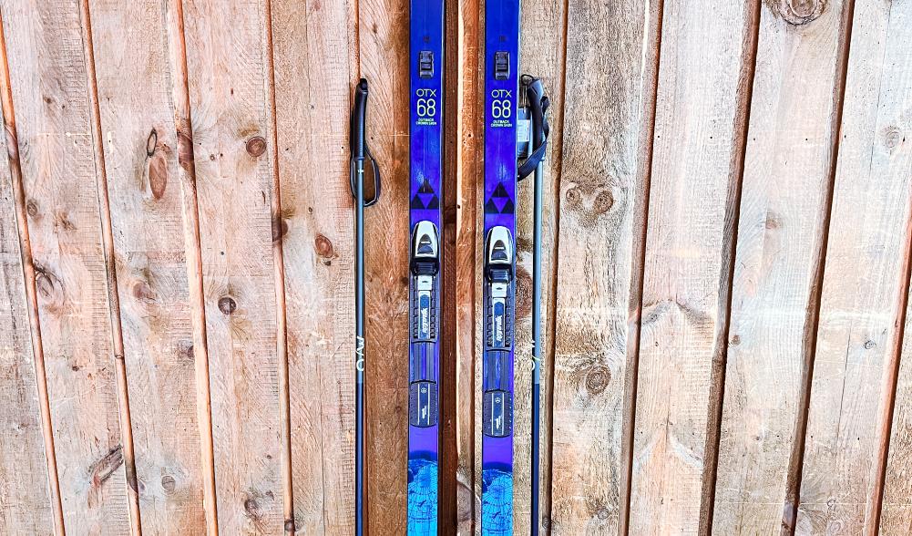 A new pair of blue skis and boots on display