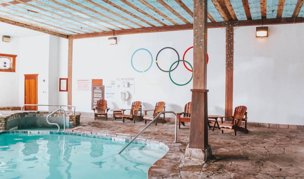 The Olympic Rings adorn the wall above the indoor swimming pool at the Golden Arrow Lakeside Resort