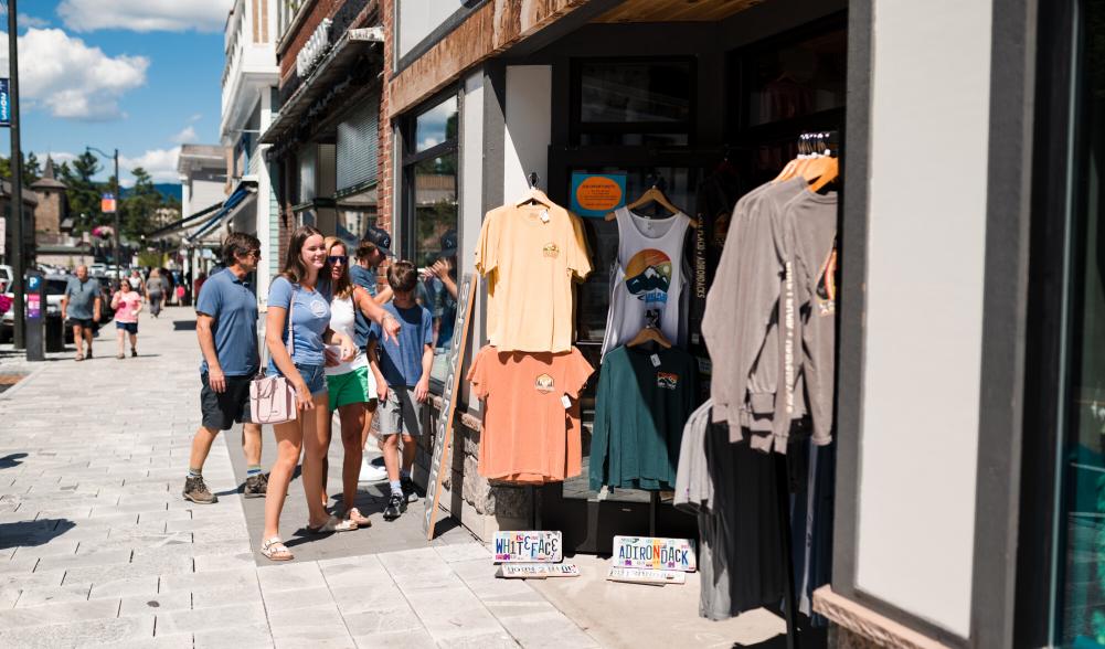 A family explores the shops on Lake Placid's Main Street.