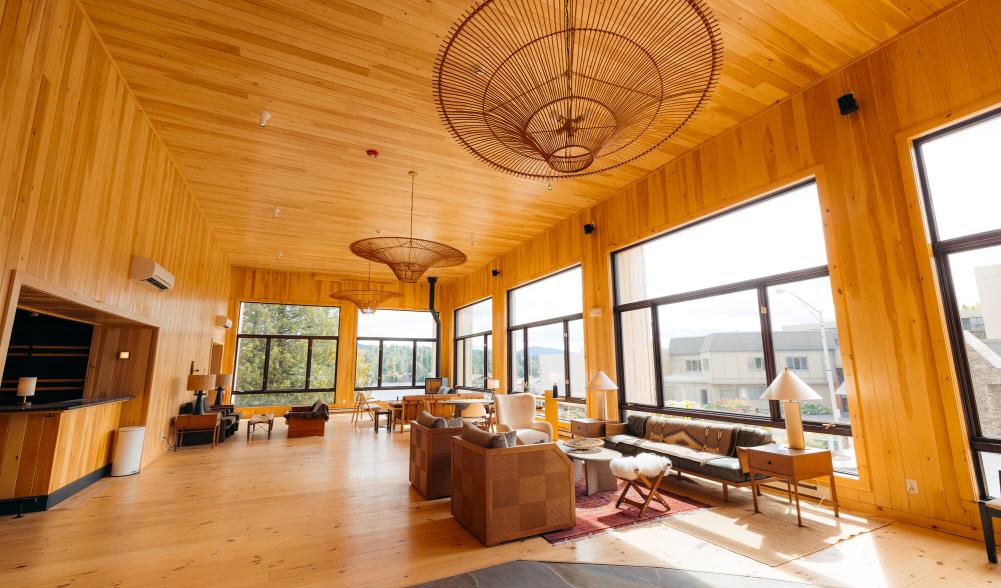 open common area with heavy wood themes and high cielings.