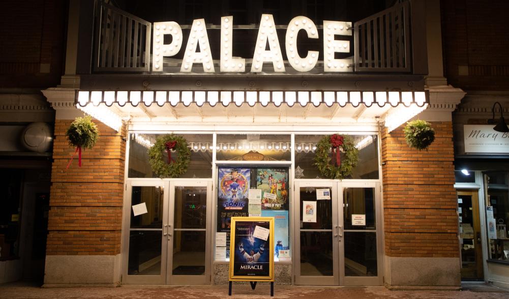 Outdoor lighting illuminates the historic Palace Theater in Lake Placid after dark