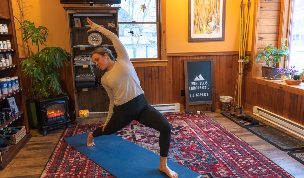 A woman does a yoga pose