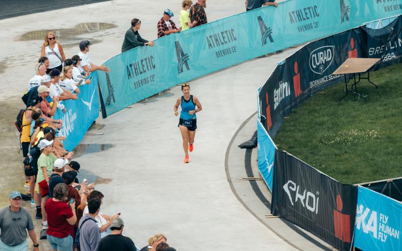 Ironman athlete approaching finish on oval
