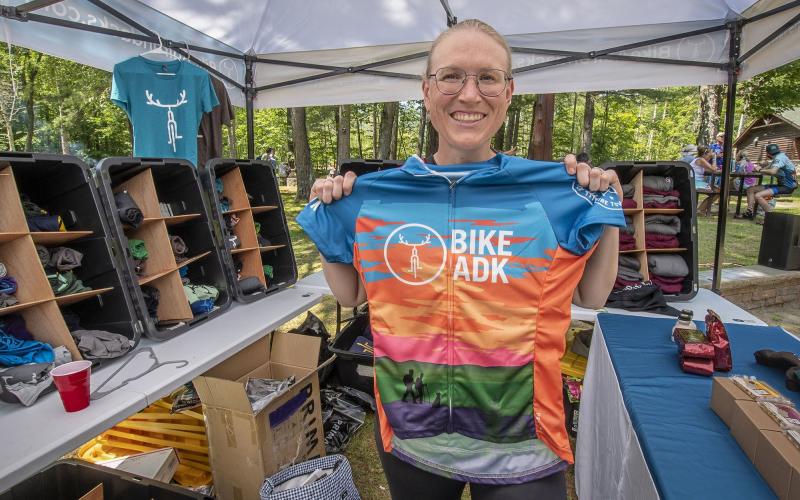 Event participant holds up race jersey