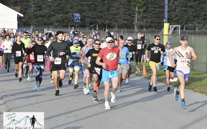 Participants run at the horse show grounds in the Lake Placid Classic half marathon